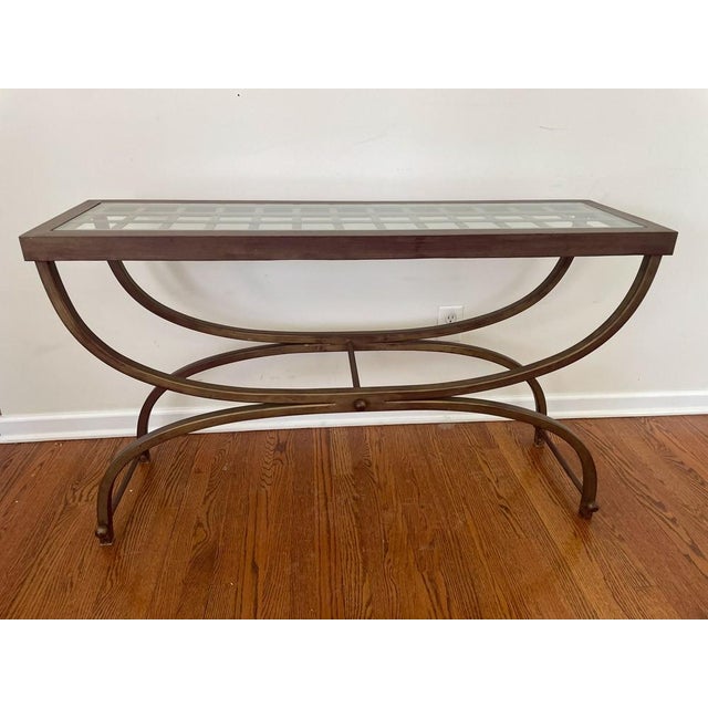 Bombay Company Cricket Console Table 1990s Vintage Hollywood Regency Bronze and Glass This iconic Cricket console table by...