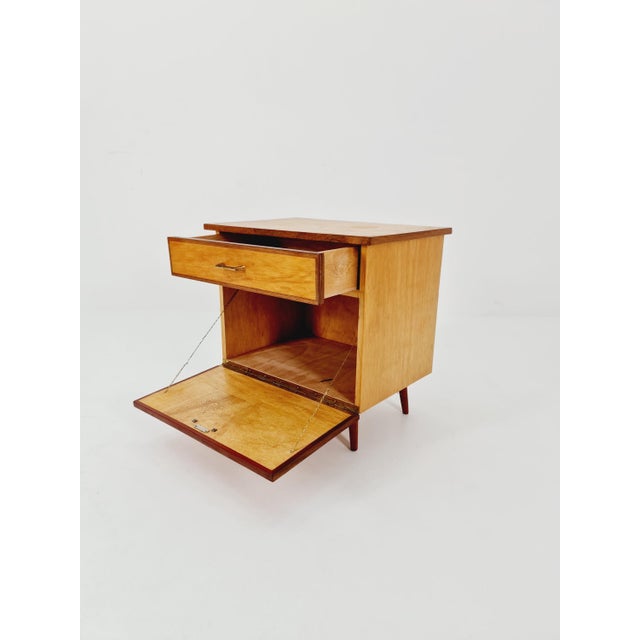German mid-century beech and teak nightstand/bedside table by WK Möbel, 1960s. It is in good vintage condition; however,...