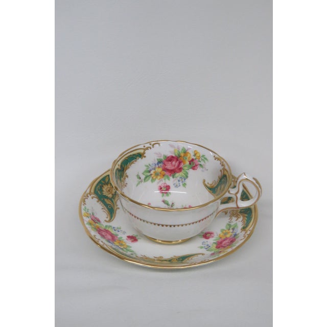 This lovely tea cup is made of bone china. This set is stamped as being made by Royal Stafford in England, Gloria design....