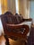 An exceptional hand-carved solid teak wood sofa imported from Thailand in 2001. This striking three-seat piece features...
