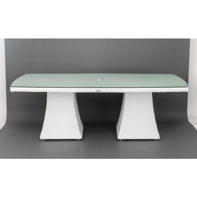 Skyline Design Glass Top Dining Table, on white plastic base with central slot for umbrella. 29.5" H x 86" W x 43" D....
