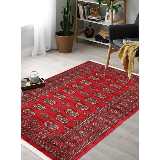 Transform your home interior with an exquisite hand-knotted Bokhara rug. This masterpiece features intricate designs and...