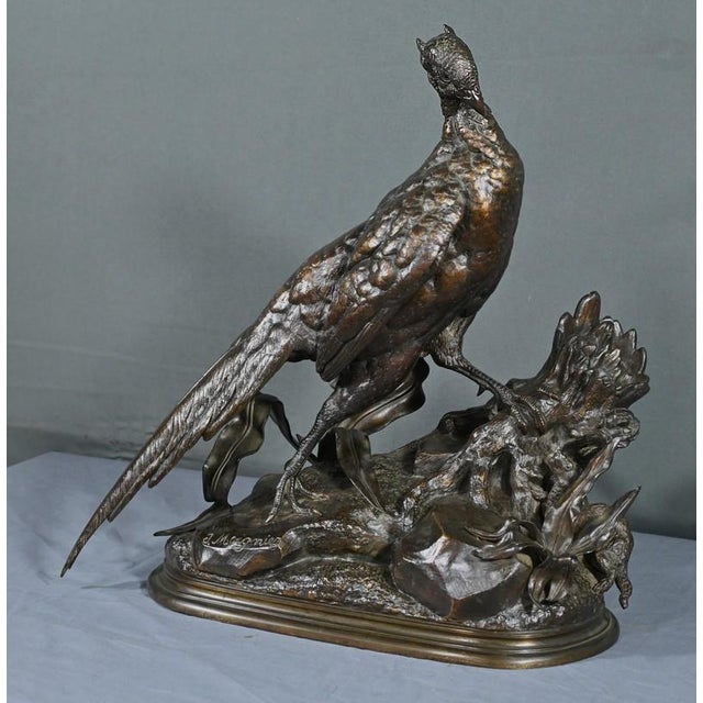 This bronze sculpture with a moderately nuanced patina, entitled “The Pheasant and the Weasel”, was made by J. Moigniez at...