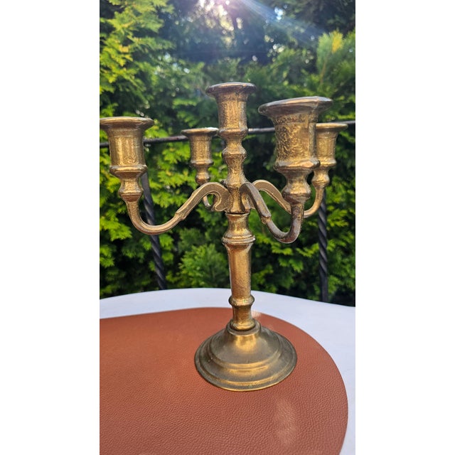 Art Deco brass five-arm candlestick, dimensions: height 27.8 cm; inner candle holder diameter 1.3 cm; base diameter 11 cm;...