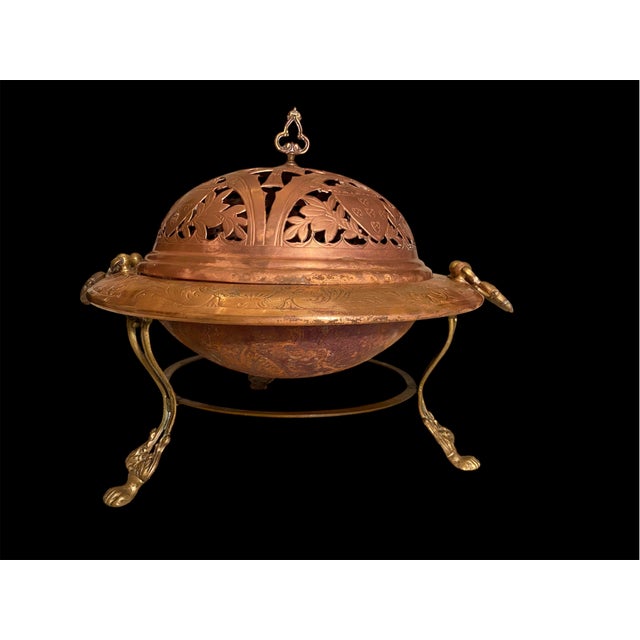 Elegant brazier all handmade . Copper and brass. It furthers a pierced domed cover, engraved copper gallery,three cast...