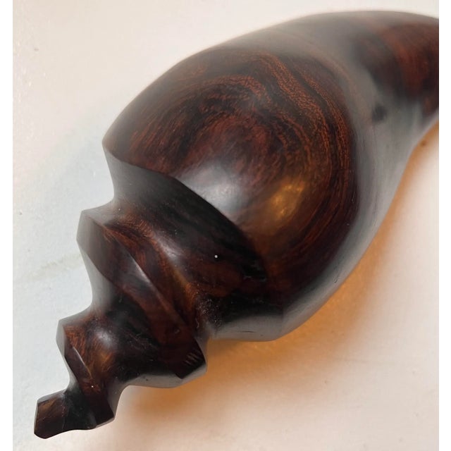 Heavy vintage teak shell with minimalistic design, smooth finish and beautiful warm wood grain details.