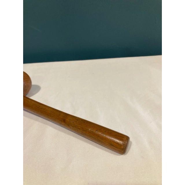 A vintage finds decorative accent with real presence — this antique wooden gavel features a distinctive double-ball head...
