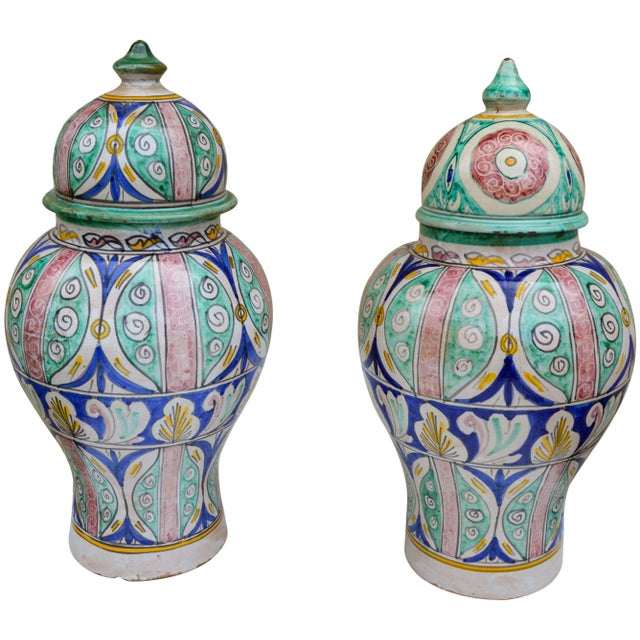 Antique handcrafted and glazed ceramic set of two vases. Featuring an intricately hand-painted Moorish pattern in a...