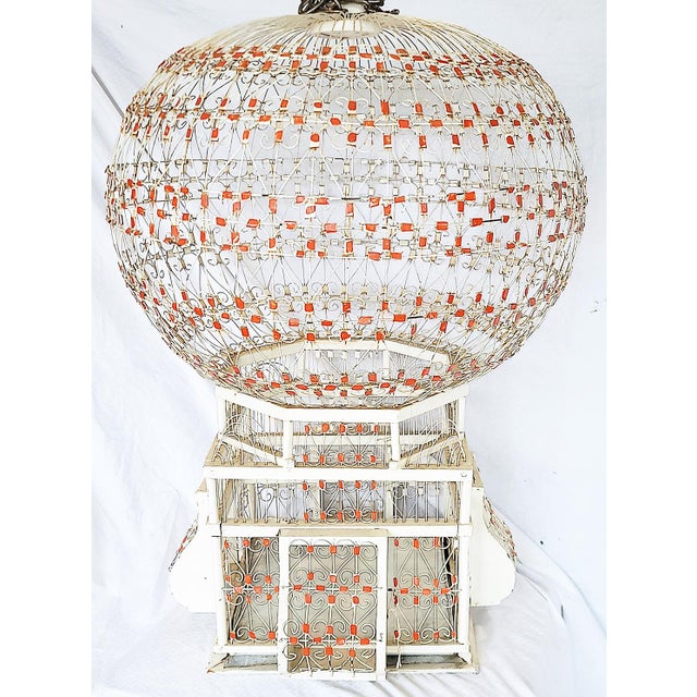 What a decorative wire birdcage, Moroccan origins all handmade. Slide out tray in the base. Add a couple artificial birds...