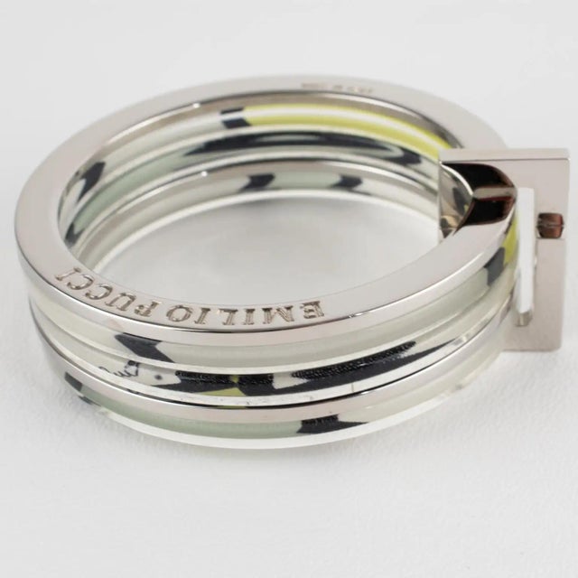 Emilio Pucci designed this stunning stacked bracelet bangle set, crafted from silvered metal, acrylic, and silk. The bold...
