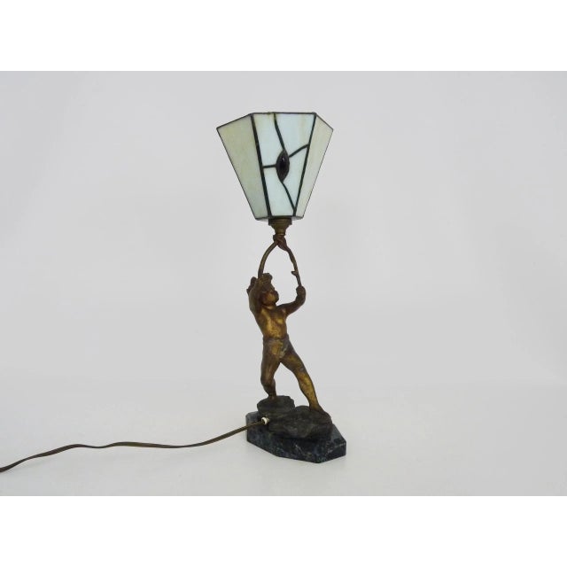 Magnificent Art Deco cherub lamp by Peyre in spelter and glass paste Magnificent spelter table lamp on a marble base,...