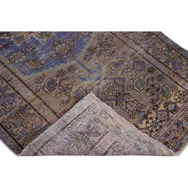 Beautiful Vintage Geometric hand-knotted wool rug with a brown field. This rug has blue accents all-over a geometric...