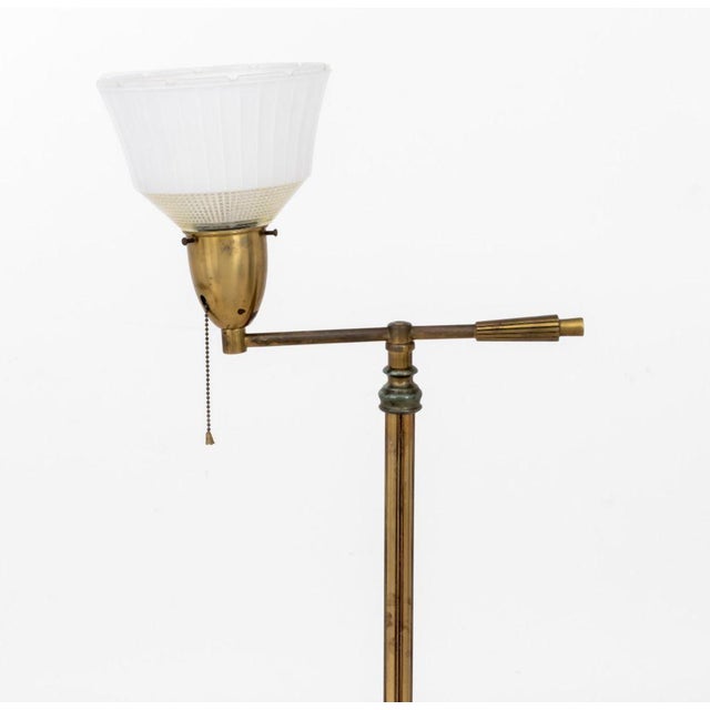 Modern Brass Articulated Floor Lamp, with single arm and glass shade. 52.75" H x 16" W x 11" Diameter. Provenance: From a...