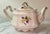 Arthur Wood & Son teapot, likely the "Dorset" model, featuring a floral design with yellow and purple flowers and gold...