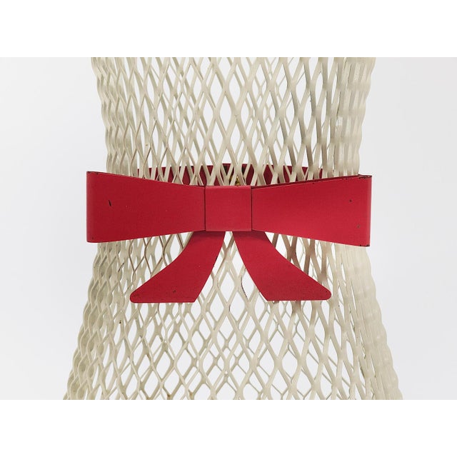 An adorable and charming French Midcentury umbrella stand or cane holder from the 1950s. This chic piece is crafted from...