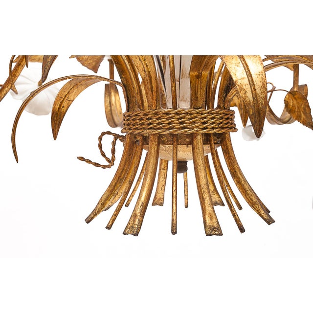 Florentine chandelier with eight lights. Masca, Italy. Gilt-plated metal. Enamelled metal flowers and cups. Recently...