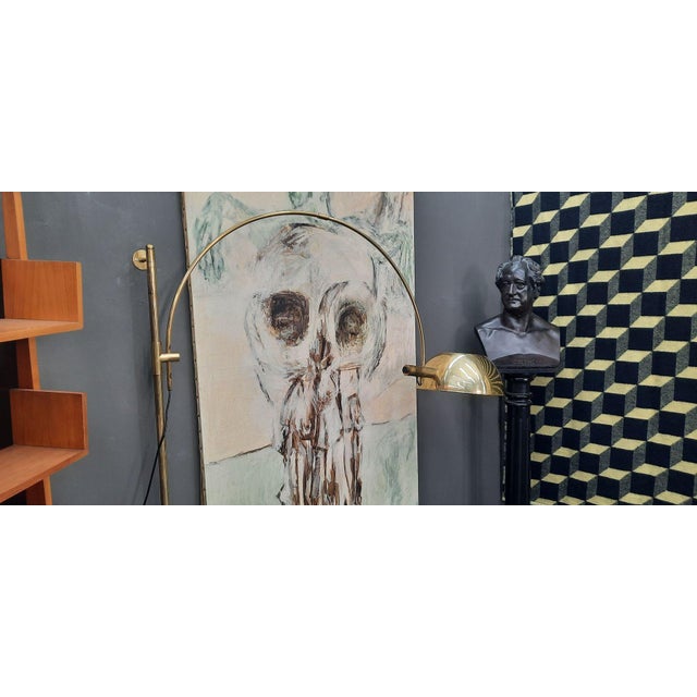 Elegant wall arc lamp by Florian Schulz. A rare and sought-after design classic. Made in Germany in the 1970s. The lamp is...