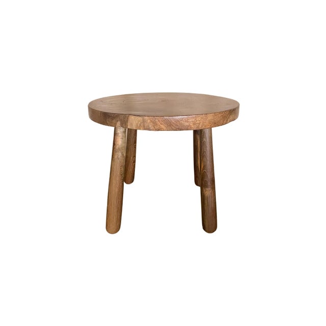 A set of sculptural teak wood side tables which feature an incredible teak burl wood patterning on their table tops....