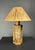 Gorgeous hexagonal cork table lamp base from Germany 1970s in the style of Ingo Maurer with new raffia shade. The lamp is...