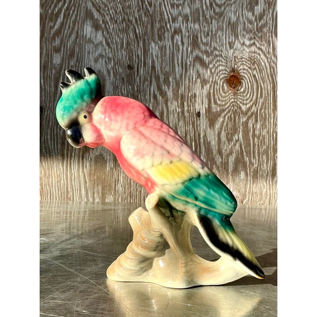 Brighten up your decor with this stunning vintage glazed ceramic parrot. Handcrafted with exceptional detail, this vibrant...