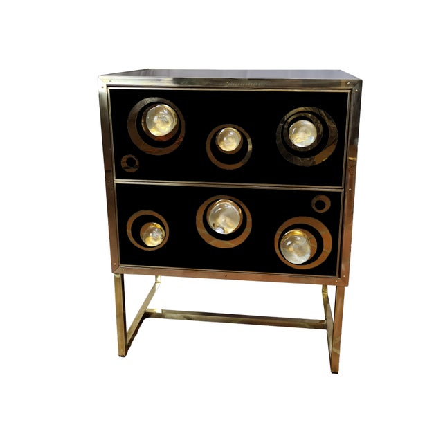Pair of Italian black bedside tables with Murano glass and brass details. Each nightstand has two drawers, with three...