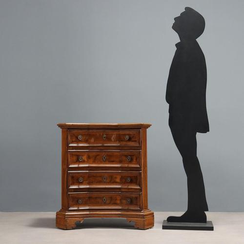 Baroque walnut bedside table with four drawers. Leaf-shaped front veneered in walnut burl with maple trim, bronze knobs...