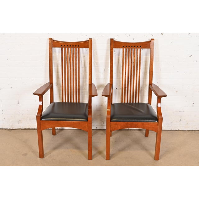 An exceptional pair of Mission or Arts & Crafts style high back spindle armchairs or dining captain chairs By L. & J.G....
