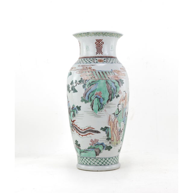 A mid-Qing Dynasty Chinese five-color vase depicting a group of immortal figures, marked with the Kangxi reign mark. The...