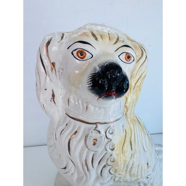 A taller Staffordshire to add to your collection. This one is glazed in a nice golden blonde with a black nose and rusty...