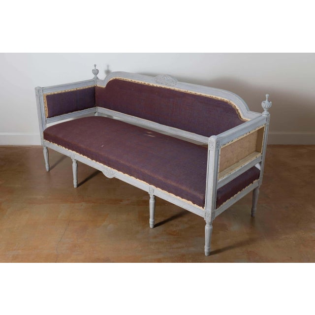 This 20th-century Swedish sofa is a stunning example of Gustavian Revival design, blending timeless elegance with...