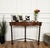 Very elegant and refined Italian 1960s Mid-Century Modern design console table highlighted by the 3 beautifully shaped...