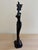 This beautiful African-inspired figurine features an elegant woman with an elongated silhouette, gracefully carrying a...