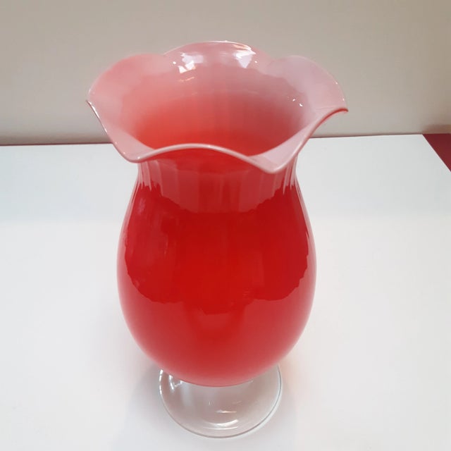 Beautiful hand blown vintage red vase with a ruffled top 11" tall.
