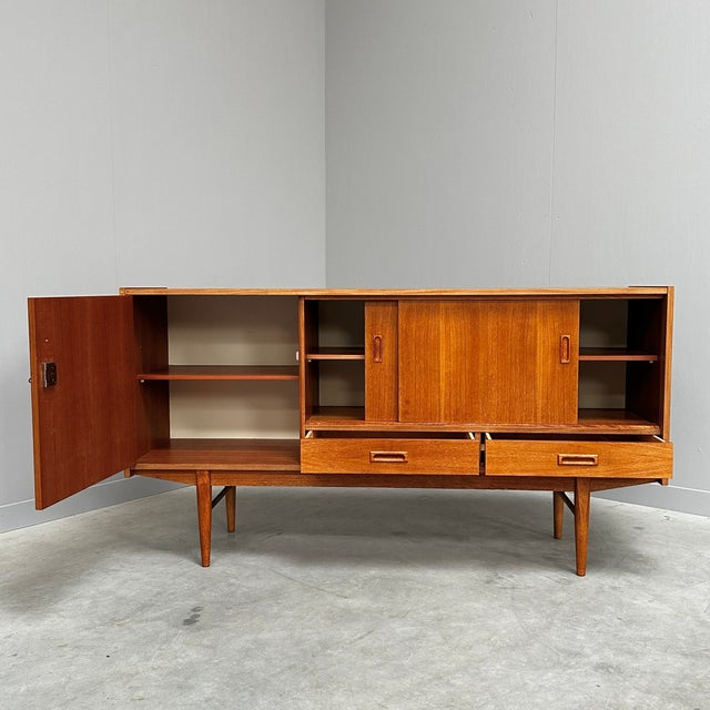 Mid-Century Modern Danish Teak Sideboard with Sliding Doors, 1960s, in Good conditions. Designed 1960 to 1969