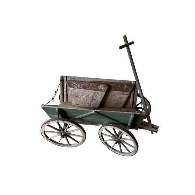 A wonderfully characterful late Victorian four-wheel hand cart, dating to the late 19th century, circa 1880–1900....