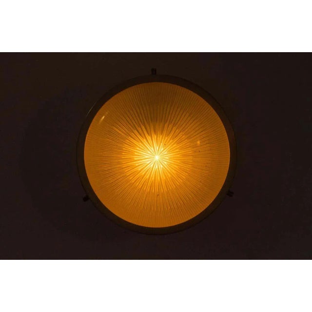 1960s Sergio Mazza Petite 'Sigma' wall or ceiling light for Artemide. Executed in nickelled brass and pressed opaline...