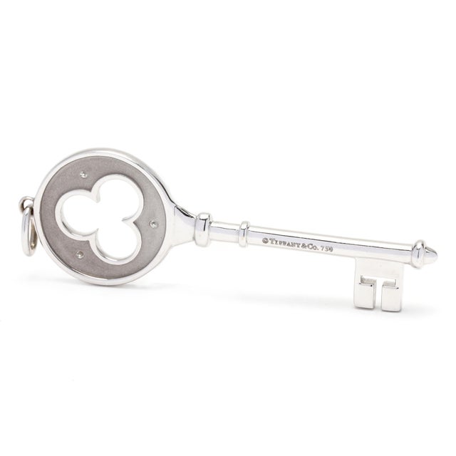 Stones: - diamonds, 3 stones - round brilliant cut - approximately .07 total carats - F-G color, VS clarity Length: 2.25...