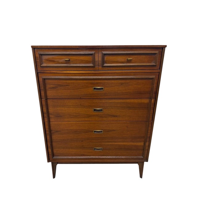 Bring timeless Mid-Century Modern style into your space with this handsome 3-piece walnut bedroom set, circa 1960s. The...