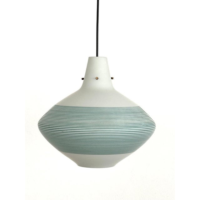 Italian onion-shaped glass lamp from the mid-20th century. The glass is matte white with blue-green stripes. The lamp is...