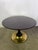 Round dining table in mahogany wood and brass base made in the 1950s.