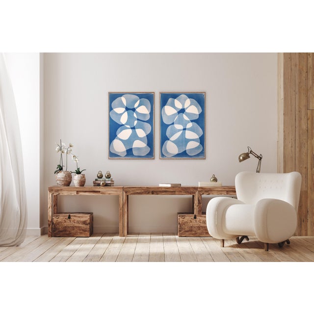 This unique monotype cyanotype explores rhythm and transparency through layered organic forms set against deep ultramarine...