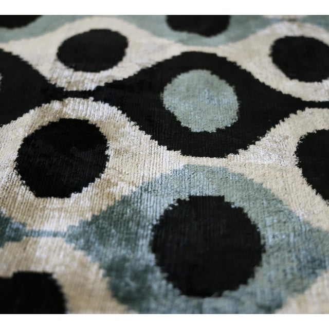 "Bold geometry meets artisanal craftsmanship in this striking handmade silk velvet throw pillow. Showcasing an oversized...