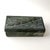 Vintage hand-carved soapstone lidded box featuring a beautifully rendered feather motif carved in low relief across the...