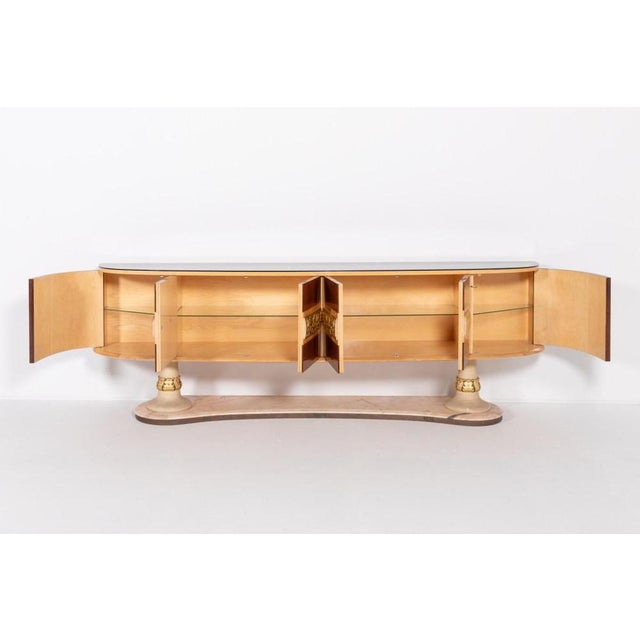 Italian Modern Mid-Century sideboard from Arredementi Borsani, 1950s. It features 6 doors with glass shelves behind them,...
