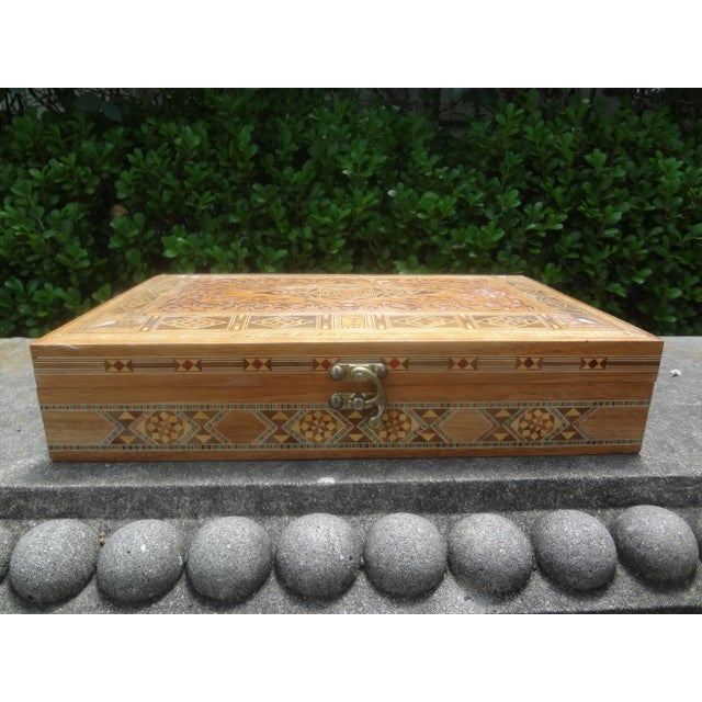 Vintage rectangular Moroccan inlaid decorative box. This unusual Moroccan or Middle Eastern Arabesque box of mixed inlaid...
