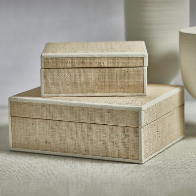 Natural texture, leather edge, built for everyday storage. The Atelier box wraps a natural raffia exterior in a leather...