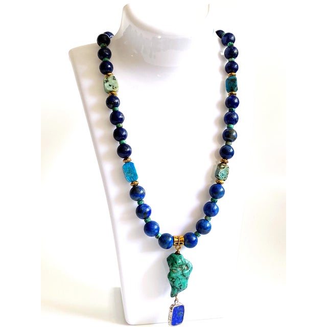 A striking celebration of color, texture, and craftsmanship, this one-of-a-kind artisan necklace showcases the timeless...