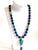 A striking celebration of color, texture, and craftsmanship, this one-of-a-kind artisan necklace showcases the timeless...