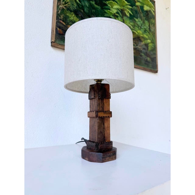 Vintage lamp with a hand-carved solid oak base in a brutalist style, dating from the 1950s. entirely handcrafted and...