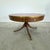 Dimensions: H 29.5” x W 47” Antique Regency style mahogany pedestal drum table with original red leather top and 4...